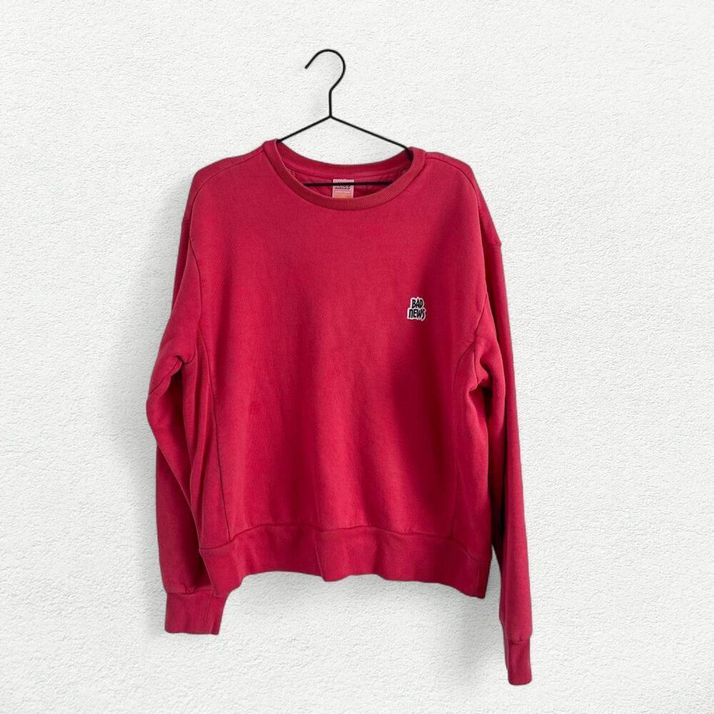 Bad News Crewneck Sweatshirt in Vintage Red / Pink